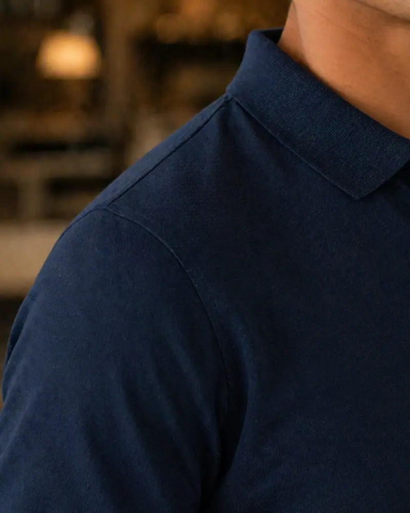 Close-up of the Supima cotton piqué at the shoulder of The Signature in Midnight